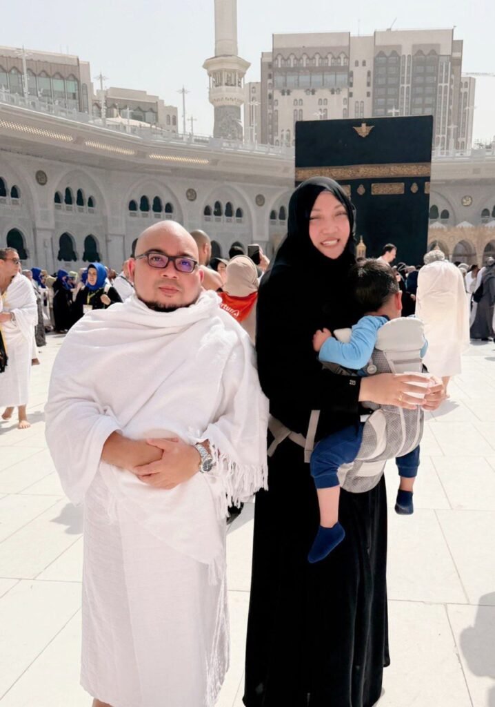 Ustaz Aarif with Wife Ustazah Nasibah and Son with back facing the Kaabah in Mecca doing Umrah